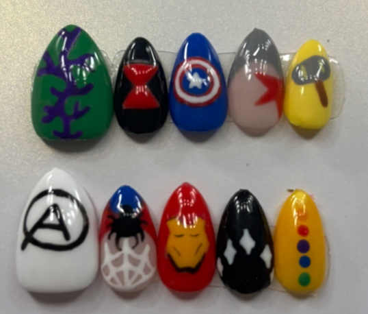 Superhero themed nails with multiple character designs
