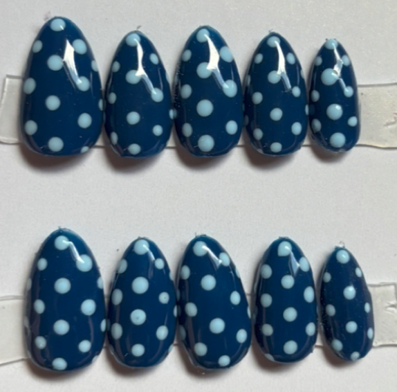 Navy blue nails with light blue polka dots