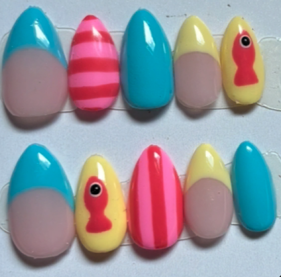 Bright blue, pink and yellow nails with fish art